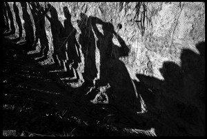 MES1980006W00016/14-14A Soldiers search bus passengers along the Northern Highway, El Salvador, 1980.