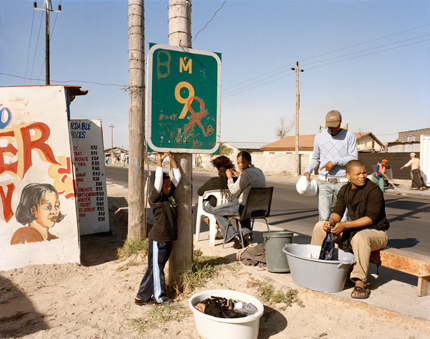 goldblatt_2_lg At Kevin Kwanele’s Takwaito Barber, Lansdowne Road, Khayelitsha, Cape Town, in the time of AIDS, 16 May 2007. Courtesy New Museum